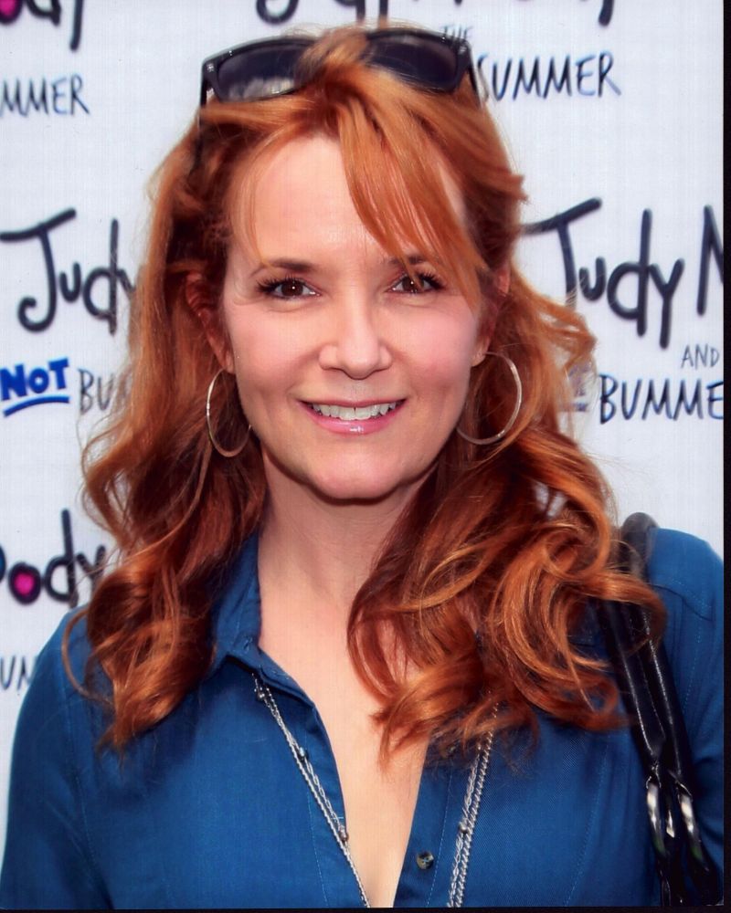 Lea Thompson photo print in blue top and sunglasses