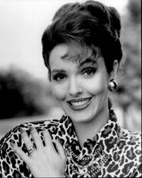 Amy Yasbeck smiling in a stylish animal print outfit - black and white photo print