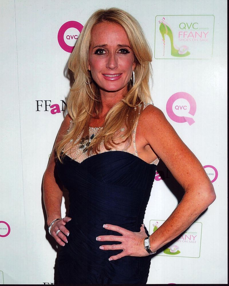 Kim Richards photo print in blue dress with hands on hips
