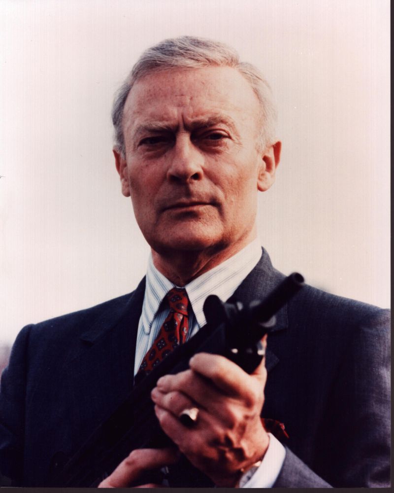Edward Woodward in a black suit with a gun from The Equalizer photo print
