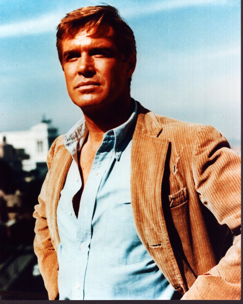 George Peppard photo print wearing corduroy jacket and blue shirt.