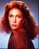 Pamela Bellwood looking over shoulder in brown polka dot top photo print.