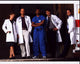 Cast of E.R. Loading Dock Photo Print featuring iconic TV characters.