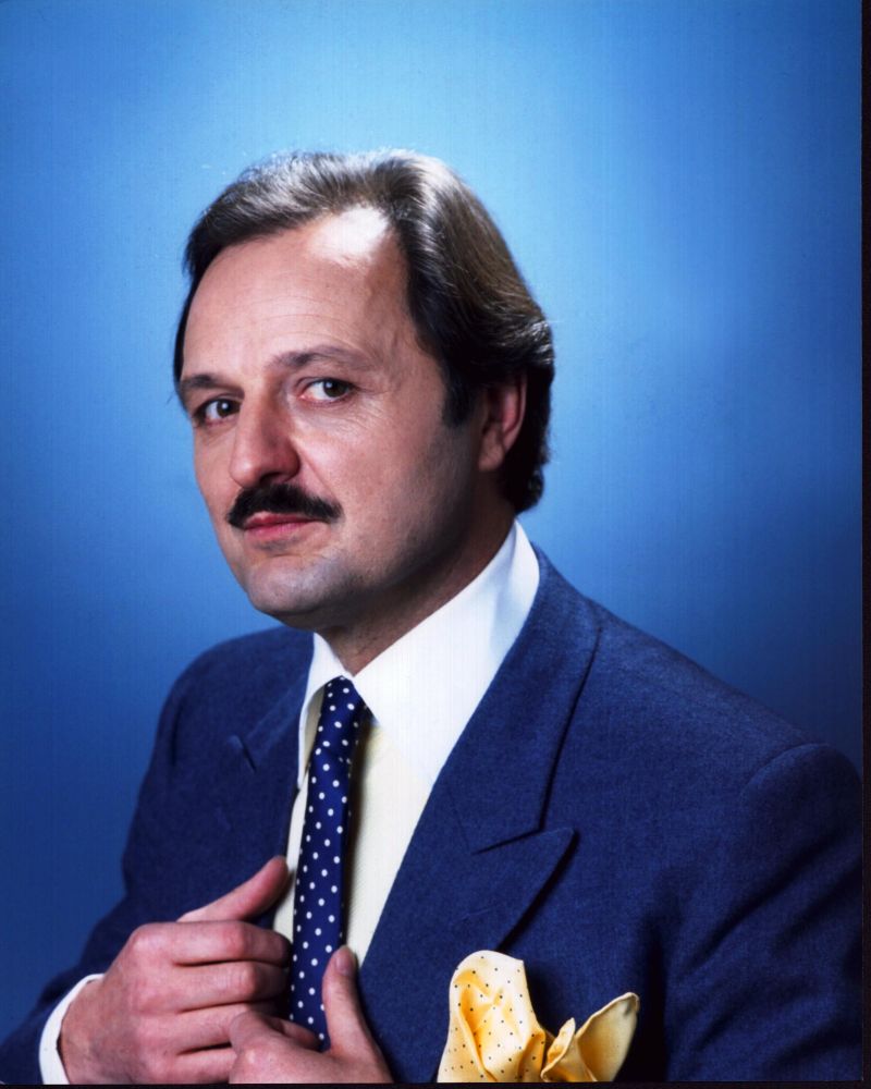 Peter Bowles photo print featuring a blue suit and yellow pocket square.