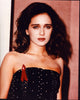 Valeria Golino in strapless black dress with red ribbon pin photo print.