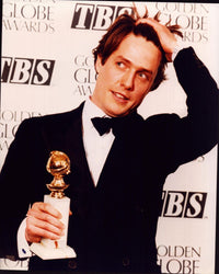 Hugh Grant holding Golden Globe Award photo print