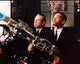 Tommy Lee Jones and Will Smith aiming guns in Men In Black 2 photo print.