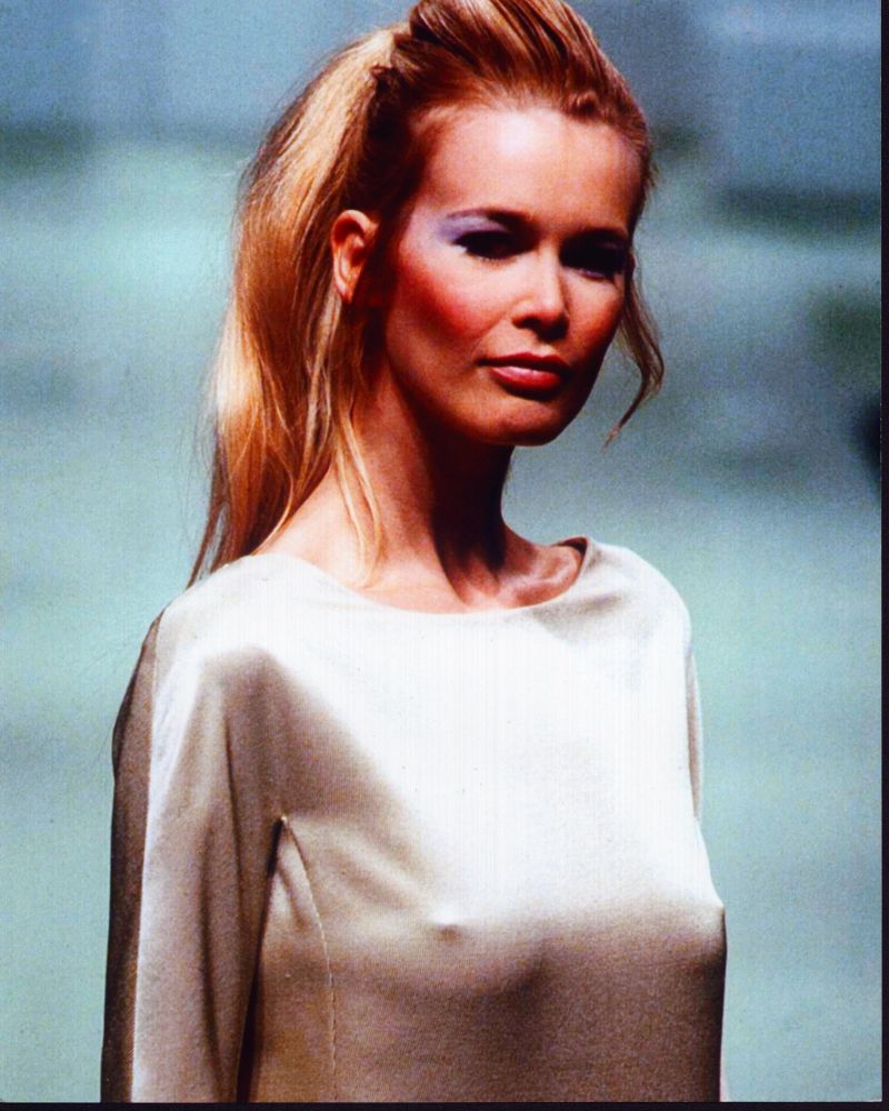 Claudia Schiffer photo print in a tan silk top, showcasing timeless elegance.