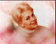 Kim Novak headshot photo print in white turtleneck, elegant film star portrait.