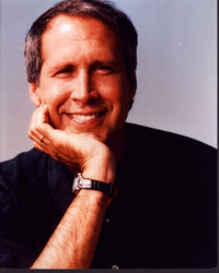 Chevy Chase smiling with head on hand photo print.