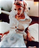 Jaime King photo print in sheer top and blue flower skirt.