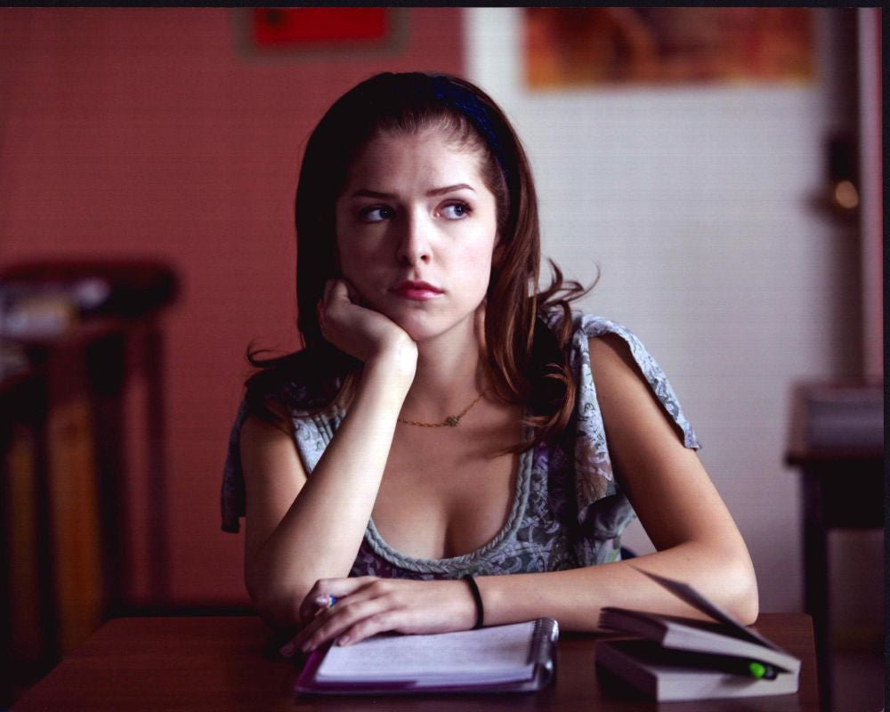 Anna Kendrick Sitting at Table with Books Photo Print