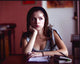 Anna Kendrick Sitting at Table with Books Photo Print