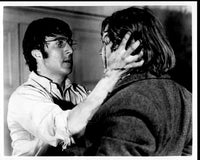 Black and white photo print of Dustin Hoffman holding Del Henney's head from Straw Dogs.