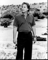 Don Johnson relaxing by a kiddie pool with sunglasses photo print.