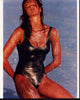 Elle Macpherson in silver bathing suit on beach photo print.