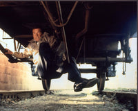 Roger Moore Under Train Car in Octopussy Photo Print