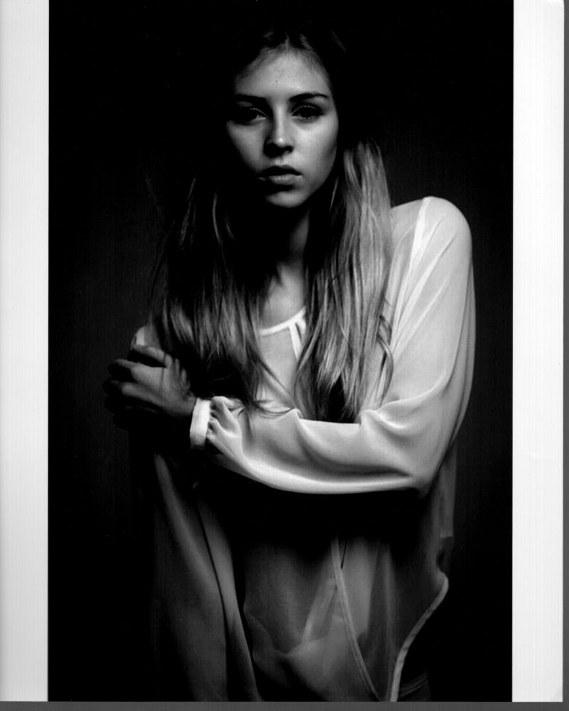 Hermione Corfield black and white photo print wearing a sheer top.