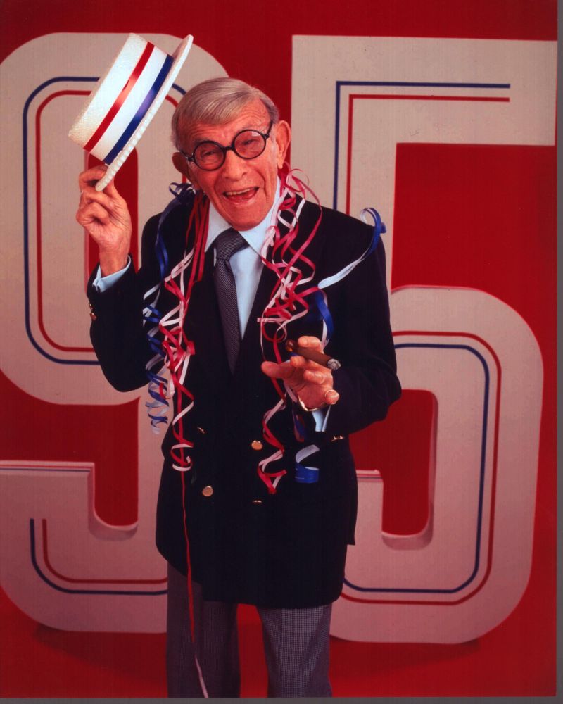 George Burns photo print with red, white, and blue hat.