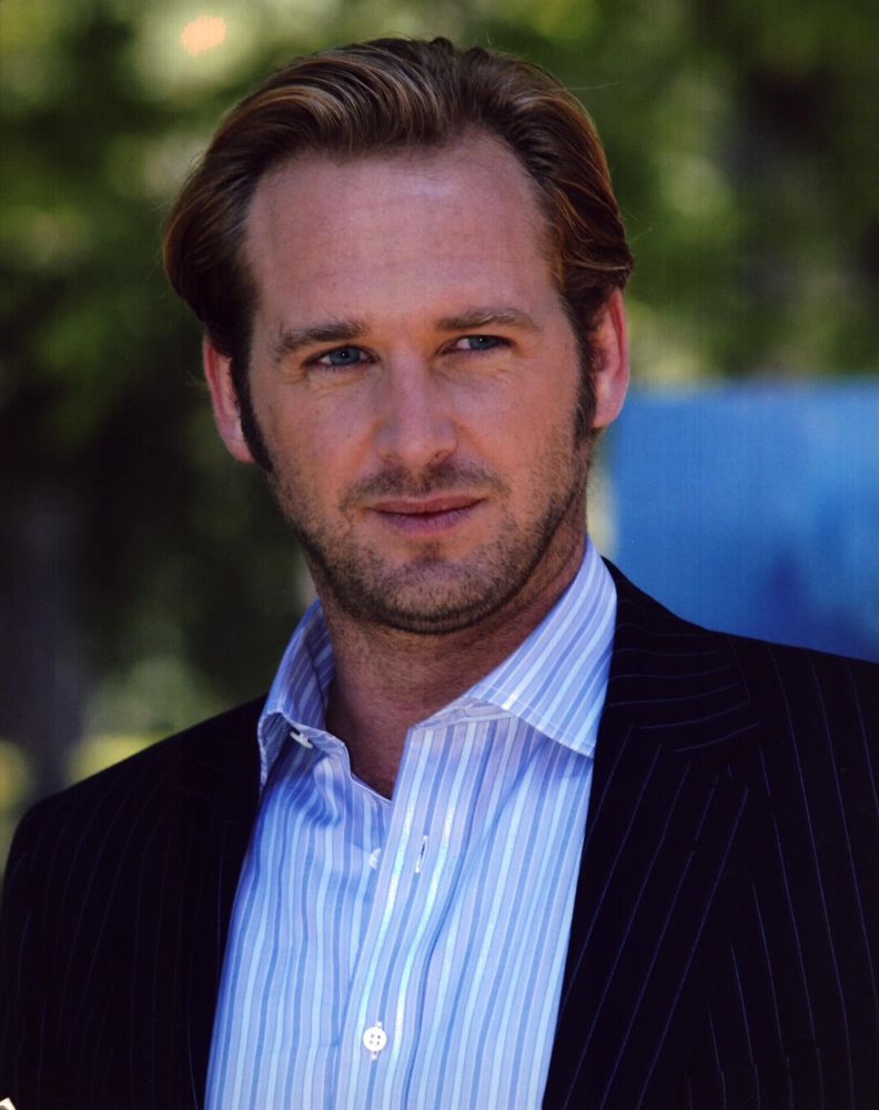 Josh Lucas photo print in pinstripe suit with blue striped shirt.
