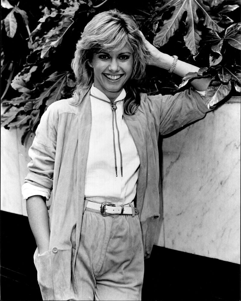 Olivia Newton John black and white photo print with hand up in hair