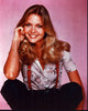 Michelle Pfeiffer sitting in floral top with suspenders photo print