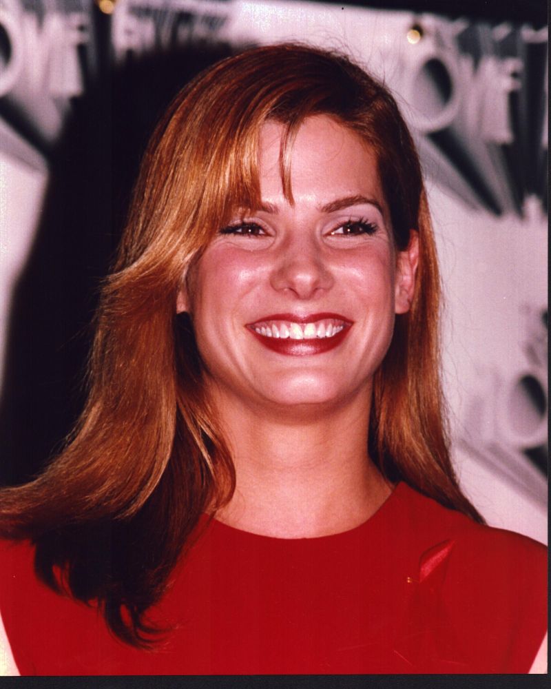 Sandra Bullock smiling in a red top photo print