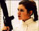 Carrie Fisher as Princess Leia holding a gun in Star Wars: Episode V - The Empire Strikes Back photo print.