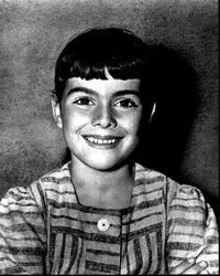 Black and white photo print of Debbie Turner in a striped dress.