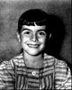 Black and white photo print of Debbie Turner in a striped dress.