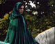 Katie McGrath on horseback in green cape from Merlin photo print