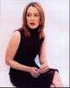 Gillian Anderson sitting in a brown leather dress photo print.