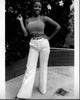 Bern Nadette Stanis black and white photo print in a striped top and white pants.