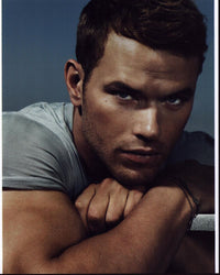 Kellan Lutz resting chin on hands photo print in multiple sizes.