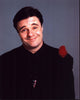Nathan Lane in black suit with red feather photo print.