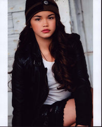 Paris Berelc photo print wearing leather jacket and knit hat.