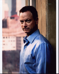 Gary Sinise photo print in blue striped shirt against wall