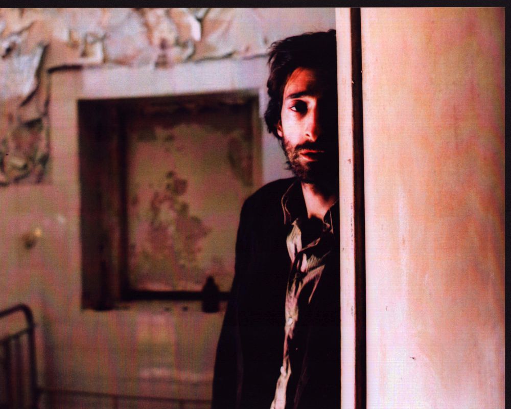 Adrien Brody in doorway scene from The Pianist photo print.
