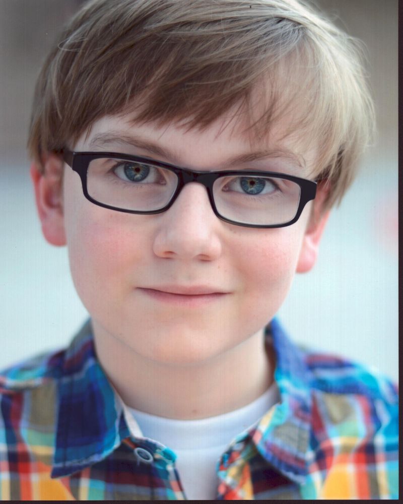 Major Dodson photo print in multicolored plaid shirt.