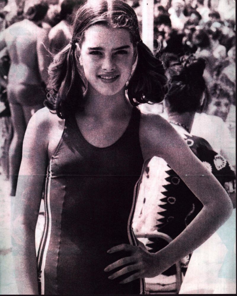 Brooke Shields black and white photo print in swimsuit with hand on hip.