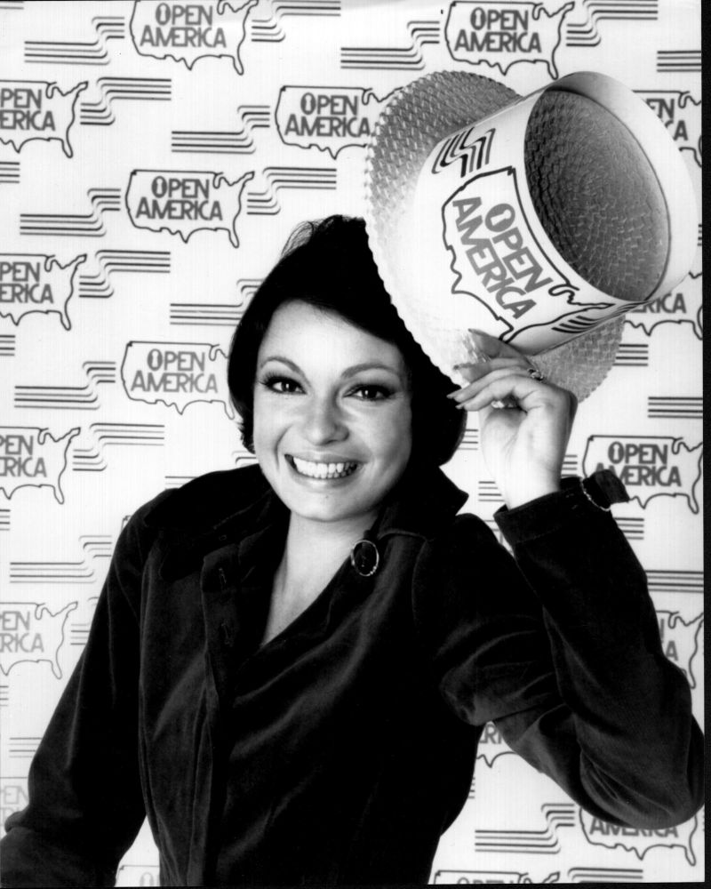 Black and white photo print of Karen Valentine wearing an Open America hat.