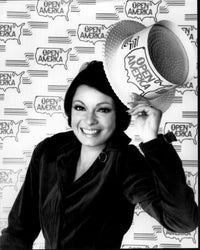 Black and white photo print of Karen Valentine wearing an Open America hat.