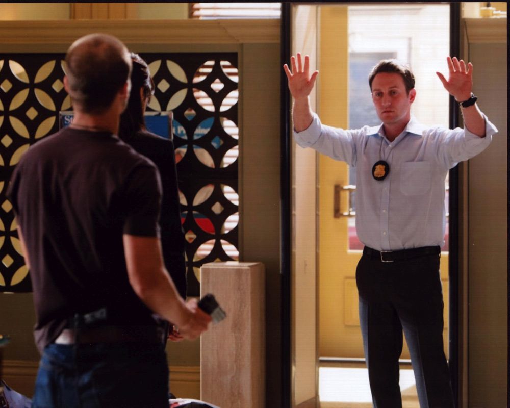 Josh Stewart with arms up in Criminal Minds photo print.