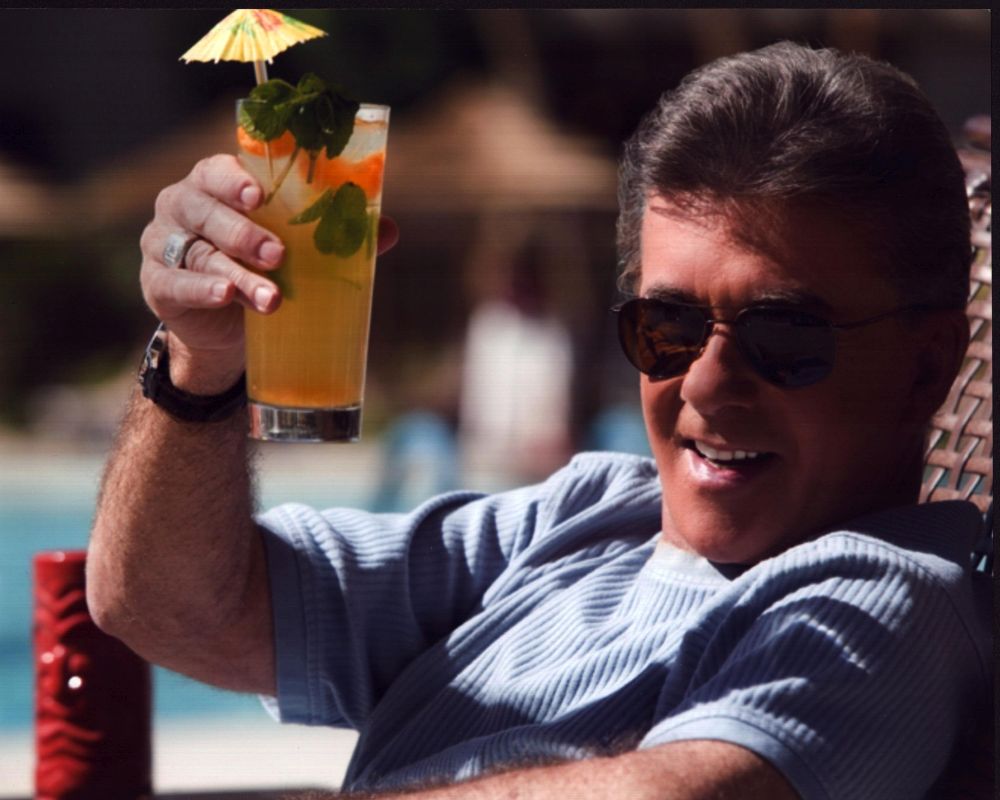 Alan Thicke holding a tropical drink photo print