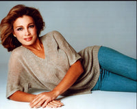 Anne Archer laying on side in tan shirt and jeans photo print