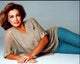 Anne Archer laying on side in tan shirt and jeans photo print