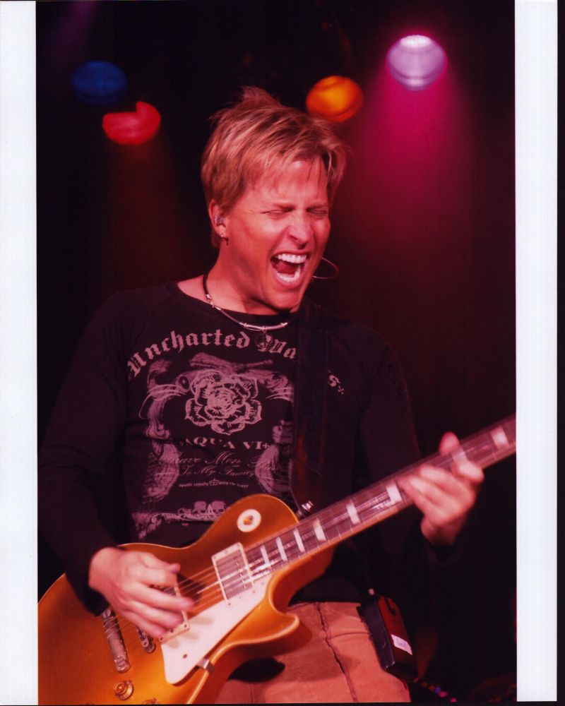 Gunnar Nelson Playing Guitar Photo Print showcasing vibrant colors and musical energy.