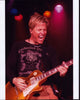 Gunnar Nelson Playing Guitar Photo Print showcasing vibrant colors and musical energy.