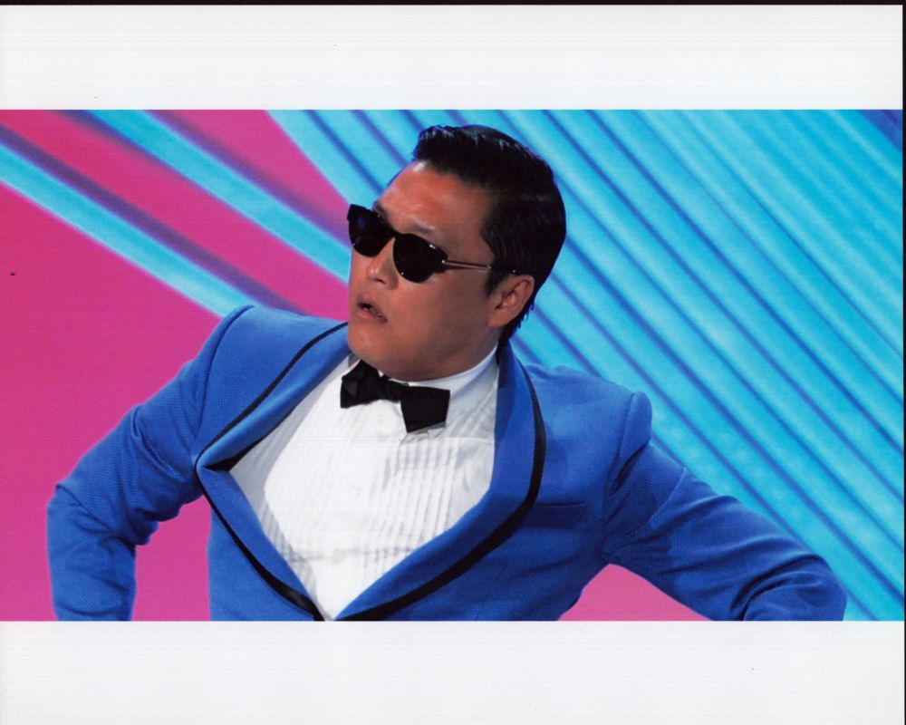 Psy Dancing in Blue Jacket Photo Print showcasing vibrant performance energy.