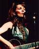 Shania Twain performing on stage in animal print turtleneck and black leather vest photo print.